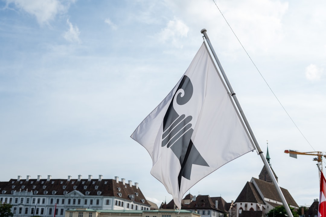 A white and black flag flying in the wind